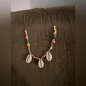 Ladies gold toned necklace with colorful beads and shells